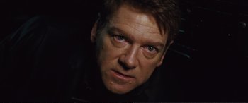 Movie still from “Jack Ryan: Shadow Recruit” (2014), directed by Kenneth Branagh – A man's face in the dark; Close Up shot, Low angle