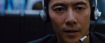 Movie still from “Jack Ryan: Shadow Recruit” (2014), directed by Kenneth Branagh – A person wearing headphones; Close Up shot, High angle
