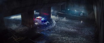 Movie still from “Jack Ryan: Shadow Recruit” (2014), directed by Kenneth Branagh – An emergency vehicle is parked in a flooded area; Extreme Wide shot, High angle