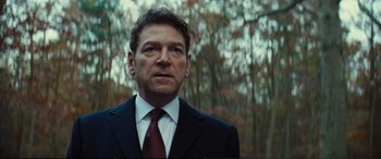 Movie still from “Jack Ryan: Shadow Recruit” (2014), directed by Kenneth Branagh – A person wearing a suit and tie; Close Up shot, Low angle