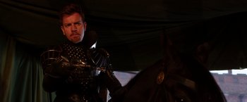 Movie still from “Jack the Giant Slayer” (2013), directed by Bryan Singer – A man dressed as a knight on a horse; Medium shot, Over the shoulder angle