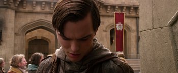 Movie still from “Jack the Giant Slayer” (2013), directed by Bryan Singer – A young man standing in front of a building; Close Up shot, Over the shoulder angle