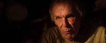 Movie still from “Jack the Giant Slayer” (2013), directed by Bryan Singer – An old man with a very intense look on his face; Close Up shot, Low angle