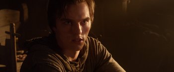 Movie still from “Jack the Giant Slayer” (2013), directed by Bryan Singer – A person wearing a hooded sweatshirt; Close Up shot, Over the shoulder angle