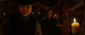 Movie still from “Jack the Giant Slayer” (2013), directed by Bryan Singer – A man and a woman standing next to each other in the dark; Close Up shot, Over the shoulder angle