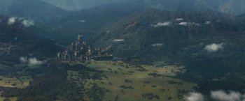 Movie still from “Jack the Giant Slayer” (2013), directed by Bryan Singer – An aerial view of a castle in the middle of a valley; Extreme Wide shot, High angle