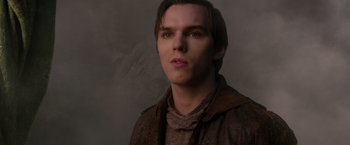 Movie still from “Jack the Giant Slayer” (2013), directed by Bryan Singer – A young man with long hair wearing a brown jacket; Close Up shot, Low angle