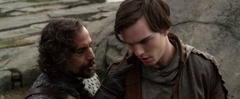 Movie still from “Jack the Giant Slayer” (2013), directed by Bryan Singer – Two men in medieval garb looking at each other; Close Up shot, Over the shoulder angle