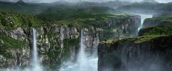 Movie still from “Jack the Giant Slayer” (2013), directed by Bryan Singer – A view of a waterfall in the middle of a valley; Extreme Wide shot, High angle