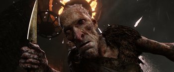 Movie still from “Jack the Giant Slayer” (2013), directed by Bryan Singer – A person with a fire behind him; Close Up shot, Low angle