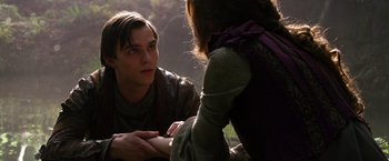 Movie still from “Jack the Giant Slayer” (2013), directed by Bryan Singer – A man and a woman sitting on the ground talking to each other; Close Up shot, Over the shoulder angle