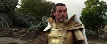 Movie still from “Jack the Giant Slayer” (2013), directed by Bryan Singer – A person wearing a suit of armor; Medium shot, Low angle