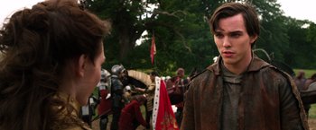 Movie still from “Jack the Giant Slayer” (2013), directed by Bryan Singer – Two men in medieval garb standing next to each other; Close Up shot, Over the shoulder angle