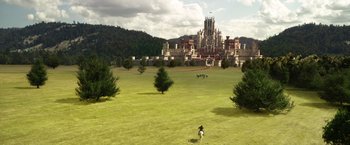 Movie still from “Jack the Giant Slayer” (2013), directed by Bryan Singer – An image of a castle in the middle of a green field; Extreme Wide shot, High angle