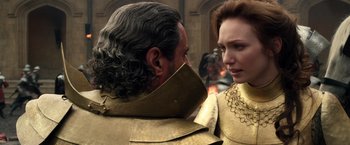 Movie still from “Jack the Giant Slayer” (2013), directed by Bryan Singer – A man and a woman wearing gold armor; Close Up shot, Over the shoulder angle