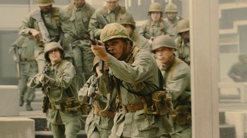 Movie still from “Jackass Forever” (2022), directed by Jeff Tremaine – A group of men in uniform are standing together; Medium shot, High angle