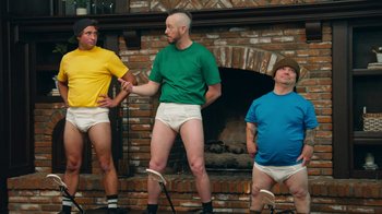 Movie still from “Jackass Forever” (2022), directed by Jeff Tremaine – A group of men standing next to each other in their underwear; Wide shot, Low angle