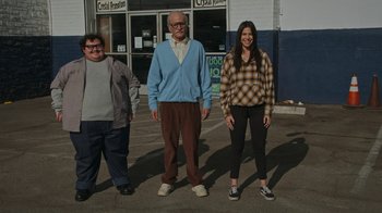 Movie still from “Jackass Forever” (2022), directed by Jeff Tremaine – A group of people standing next to each other on the street; Wide shot, Low angle