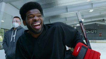 Movie still from “Jackass Forever” (2022), directed by Jeff Tremaine – A man laughing while holding a baseball bat; Close Up shot, Low angle