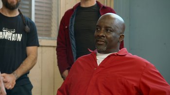 Movie still from “Jackass Forever” (2022), directed by Jeff Tremaine – A man in a red shirt is looking at the camera; Medium shot, Over the shoulder angle