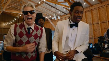 Movie still from “Jackass Forever” (2022), directed by Jeff Tremaine – A group of men standing next to each other in a room; Medium shot, Low angle