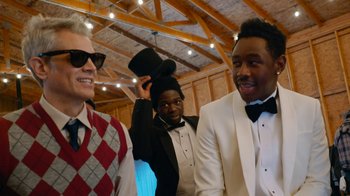 Movie still from “Jackass Forever” (2022), directed by Jeff Tremaine – A group of men in tuxedos standing next to each other; Medium shot, Over the shoulder angle