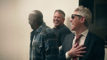 Movie still from “Jackass Forever” (2022), directed by Jeff Tremaine – A group of men standing next to each other; Medium shot, Over the shoulder angle