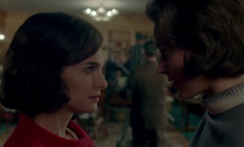 Movie still from “Jackie” (2016), directed by Pablo Larraín – A woman in a red dress and a man in a red jacket; Close Up shot, Over the shoulder angle