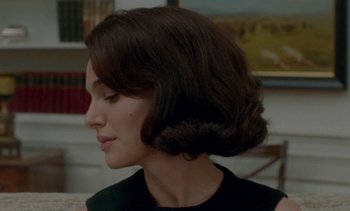Movie still from “Jackie” (2016), directed by Pablo Larraín – A person wearing a black dress; Close Up shot, Over the shoulder angle