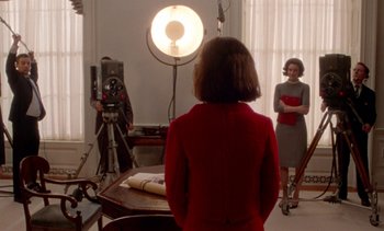 Movie still from “Jackie” (2016), directed by Pablo Larraín – Two women are in a room with a camera; Medium shot, Over the shoulder angle