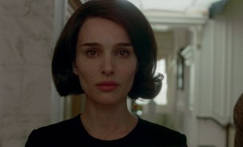 Movie still from “Jackie” (2016), directed by Pablo Larraín – A person wearing a black shirt; Close Up shot, Over the shoulder angle