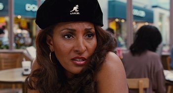 Movie still from “Jackie Brown” (1997), directed by Quentin Tarantino – A person wearing a hat; Close Up shot, High angle