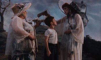 Movie still from “James and the Giant Peach” (1996), directed by Henry Selick – A group of people standing next to each other on a field; Medium shot, Low angle