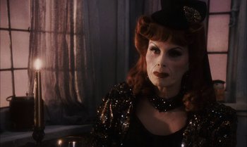 Movie still from “James and the Giant Peach” (1996), directed by Henry Selick – A person with red hair wearing a hat; Close Up shot, Over the shoulder angle