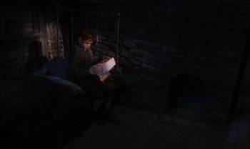 Movie still from “James and the Giant Peach” (1996), directed by Henry Selick – A person sitting on a chair in a dark room; Wide shot, High angle