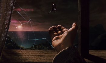 Movie still from “James and the Giant Peach” (1996), directed by Henry Selick – A person is holding their hand out to a spider; Extreme Close Up shot, Low angle
