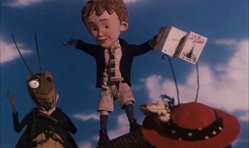 Movie still from “James and the Giant Peach” (1996), directed by Henry Selick – A paper doll of a boy flying through the air; Medium shot, Low angle