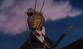 Movie still from “James and the Giant Peach” (1996), directed by Henry Selick – A creepy looking statue of a man in a suit and tie; Close Up shot, Low angle