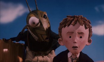 Movie still from “James and the Giant Peach” (1996), directed by Henry Selick – A bug and a boy in a suit; Close Up shot, Low angle