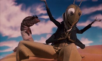 Movie still from “James and the Giant Peach” (1996), directed by Henry Selick – A cartoon of an ant and a worm in the desert; Medium shot, High angle