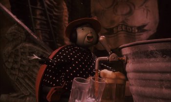 Movie still from “James and the Giant Peach” (1996), directed by Henry Selick – A teddy bear wearing a polka dot shirt and a red hat; Close Up shot, High angle