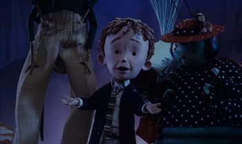 Movie still from “James and the Giant Peach” (1996), directed by Henry Selick – A cartoon of a boy with a long hair; Medium shot, Low angle
