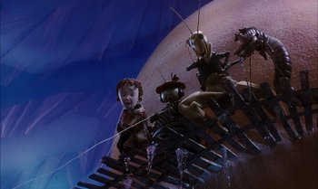 Movie still from “James and the Giant Peach” (1996), directed by Henry Selick – A group of people standing on a wooden platform; Wide shot, High angle