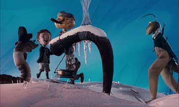 Movie still from “James and the Giant Peach” (1996), directed by Henry Selick – A toy figure of a man and a dog; Wide shot, Low angle
