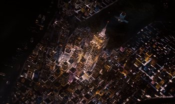 Movie still from “James and the Giant Peach” (1996), directed by Henry Selick – An aerial view of a large city at night time; Extreme Wide shot, Overhead angle