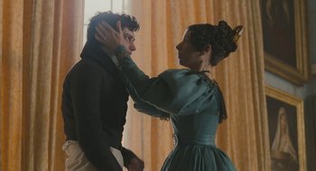 Movie still from “Jane Eyre” (2011), directed by Cary Joji Fukunaga – A man and a woman are standing together in front of a window; Close Up shot, Over the shoulder angle