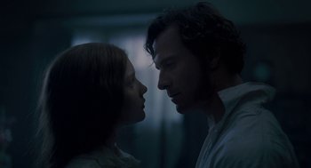 Movie still from “Jane Eyre” (2011), directed by Cary Joji Fukunaga – A man and a woman face to face in a dark room; Close Up shot, Low angle
