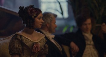 Movie still from “Jane Eyre” (2011), directed by Cary Joji Fukunaga – A woman in a dress and a man in a suit; Close Up shot, Over the shoulder angle