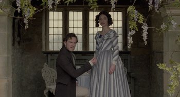 Movie still from “Jane Eyre” (2011), directed by Cary Joji Fukunaga – A man and a woman dressed up in formal clothing; Medium shot, Low angle