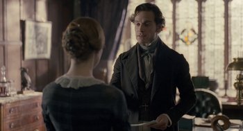 Movie still from “Jane Eyre” (2011), directed by Cary Joji Fukunaga – A man and a woman are talking to each other; Medium shot, Over the shoulder angle